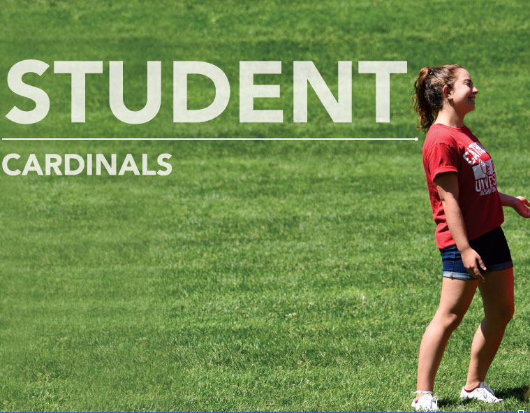 Female student standing on green lawn. Text reads Students Cardinals