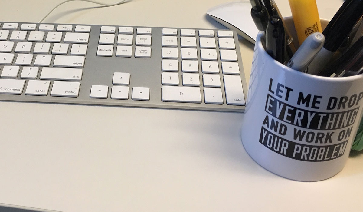 Keyboard and coffee mug