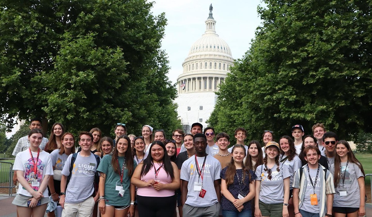 High school students pose for a photo before the Capitol during session one of The Catholic University of America’s Light the World! summer institute program June 12. 