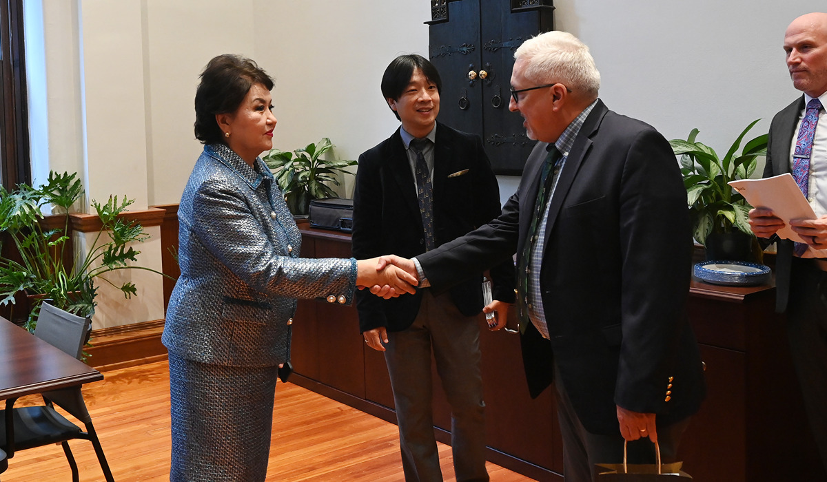 University Provost Aaron Dominguez (second from right) greets Aiman Mussakhajayeva, founder and rector of Kazakh National University of Arts (first from left) and violin lecturer Vladimir Dyo (center). Associate Dean of Undergraduate Studies and Music Performance Chair Jay Brock (first from right) looks on.