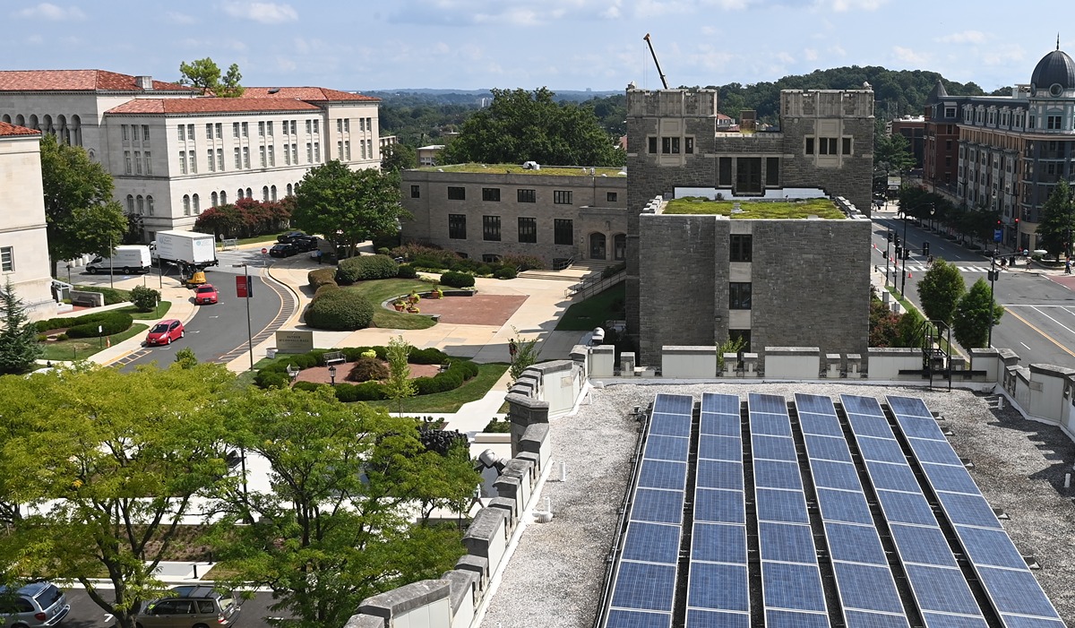 Solar panels sit on the roof of Gibbons Hall along Michigan Avenue. 