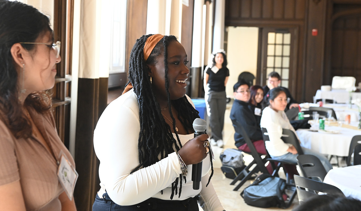 From left to right: Social work sophomore Gaby Pereira Ruano and nursing sophomore Khiya Kelly speak to the crowd during the event. (Catholic University/Patrick G. Ryan)