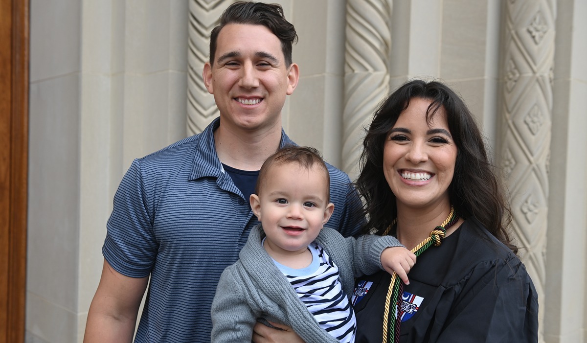 Cassandra Lopez and her young family pose for a photo on the steps of the main entrance to the Basilica of the National Shrine of the Immaculate Conception. (Catholic University/Patrick G. Ryan) 