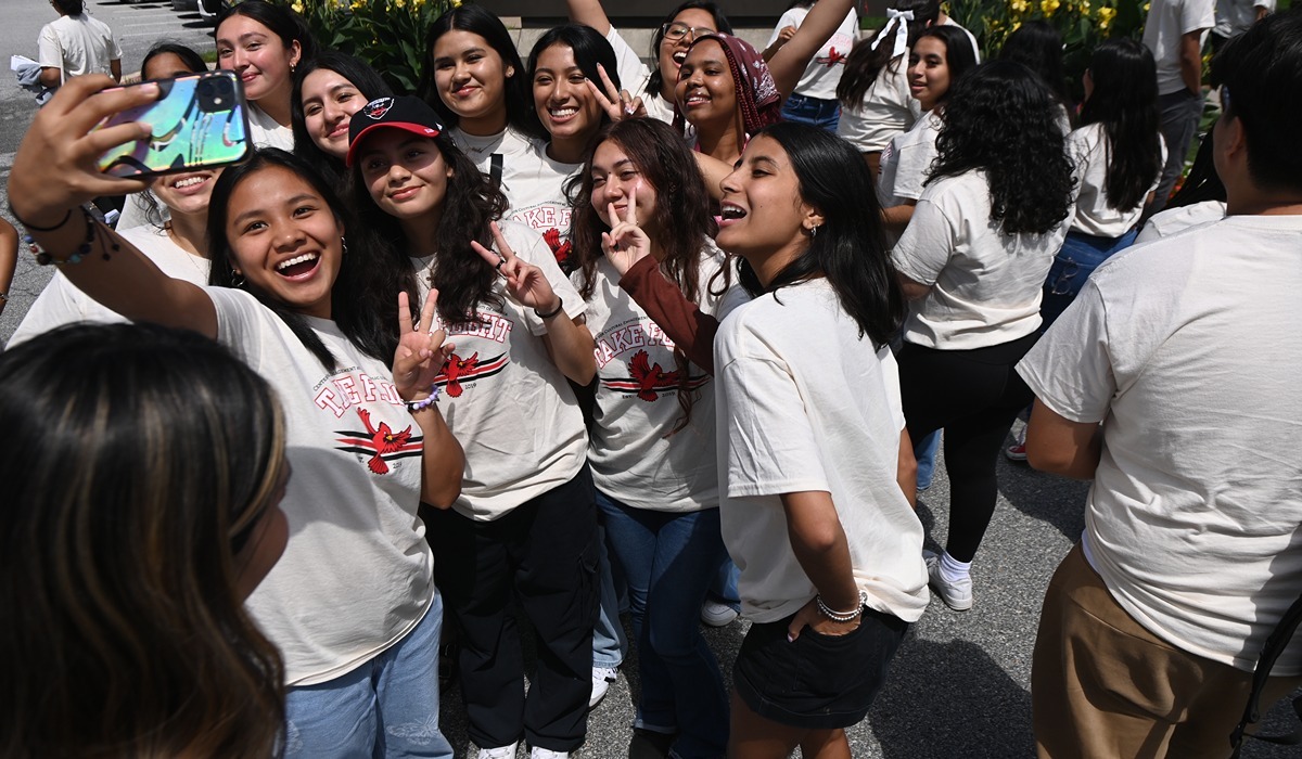 A few of this year’s cohort of Take Flight students strike a pose at the campus’ main entrance (Catholic University/Patrick G. Ryan) 