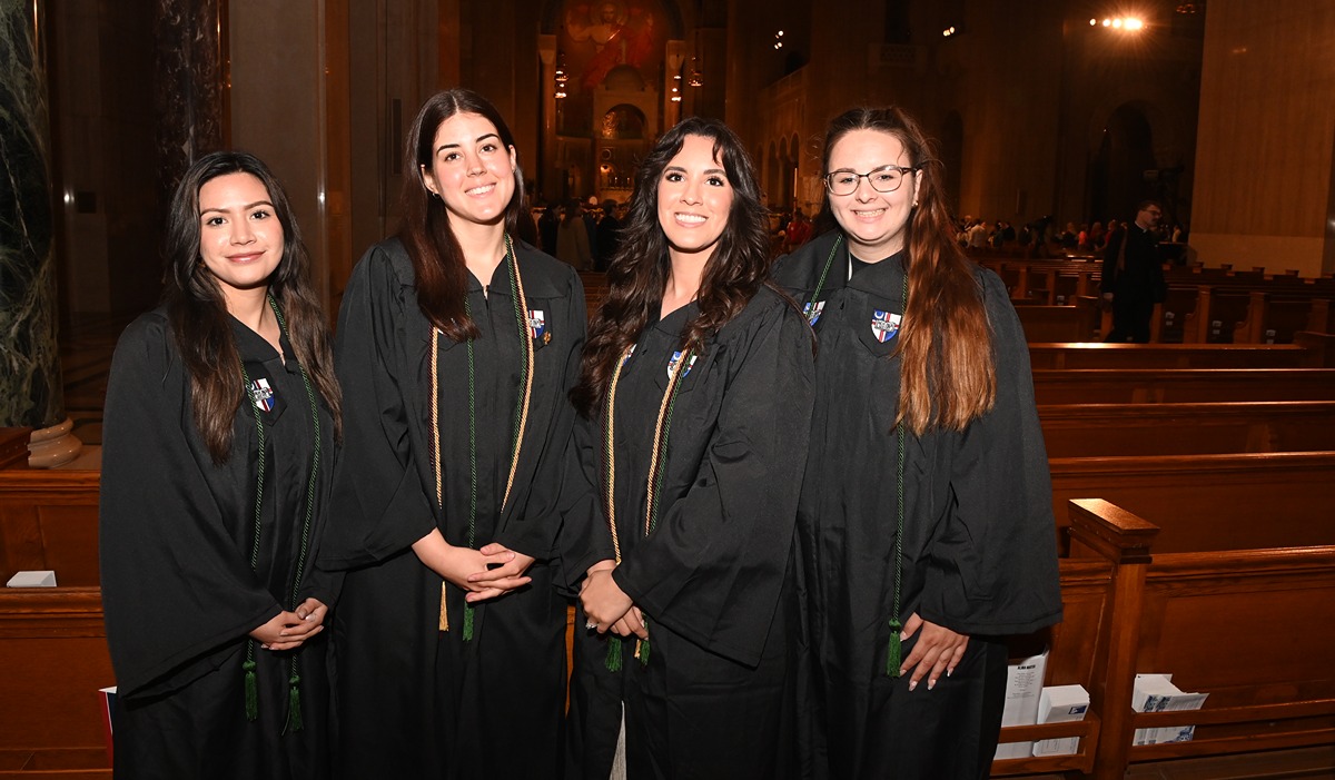 From left to right: Maria Paula Celaya Pesqueira, Isabella Cordova-Minder, Cassandra Lopez, and Samantha Reynolds attend the Baccalaureate Mass at the Basilica of the National Shrine of the Immaculate Conception. (Catholic University/Patrick G. Ryan)