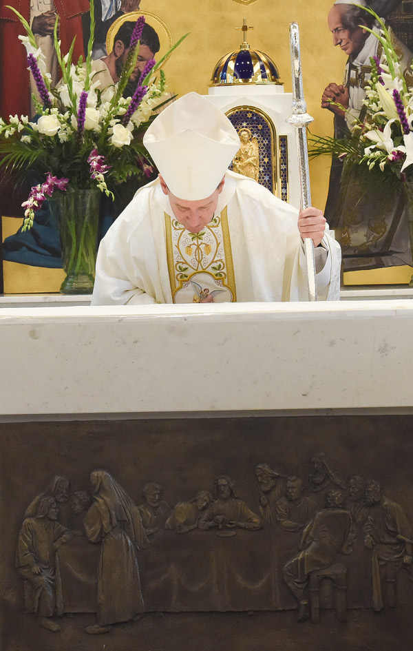  Most Rev. Michael F. Burbidge kisses the altar