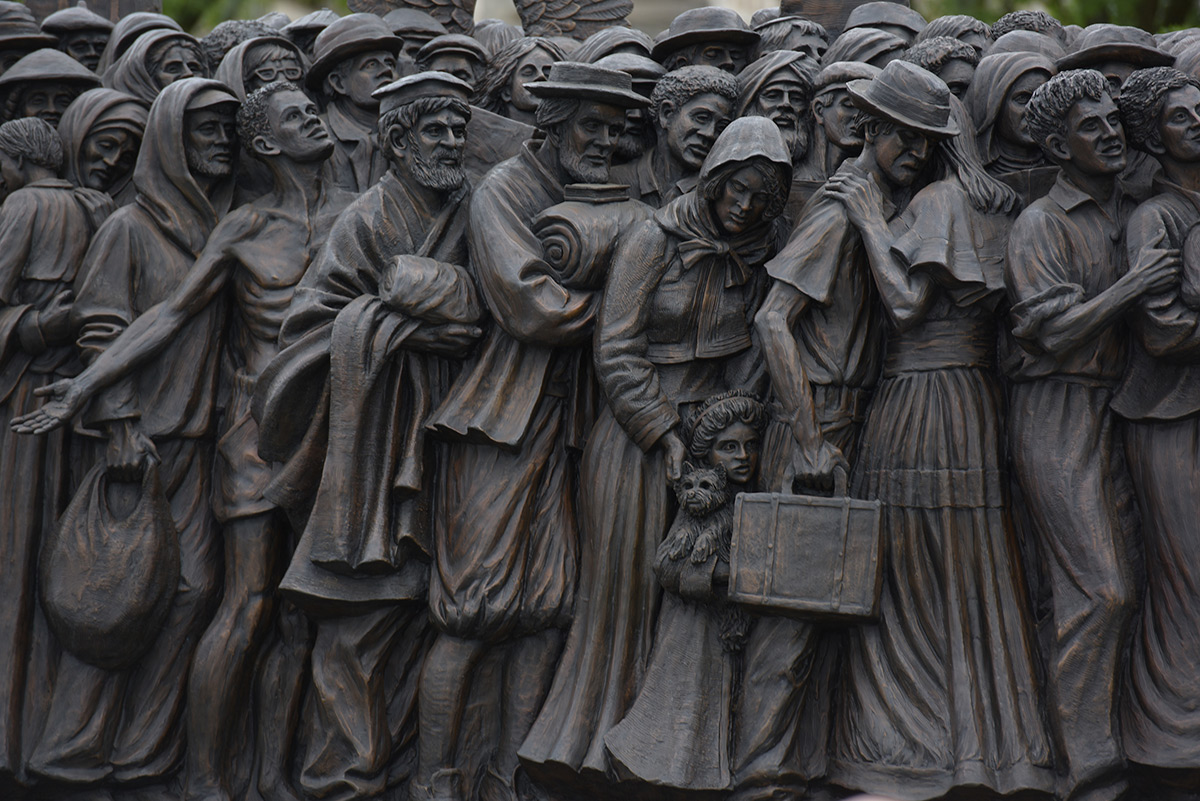 Migrants and refugees in the statue