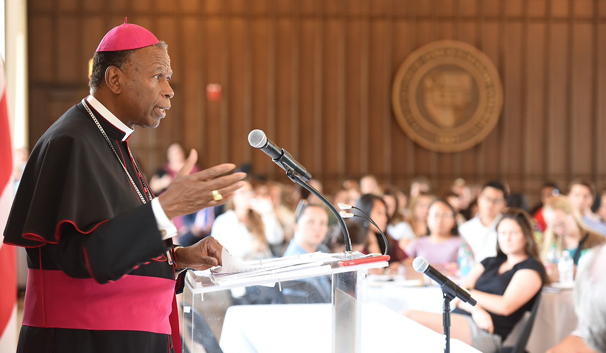 Bishop Braxton speaks to a group of students