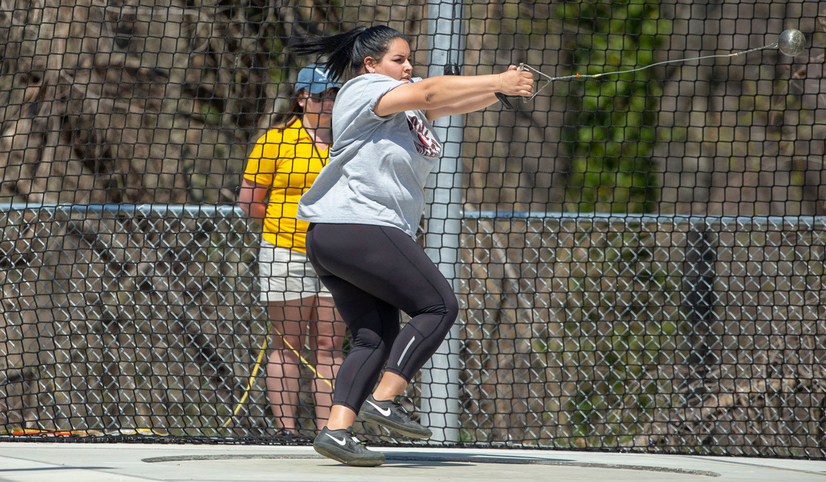 Female athlete competing in hammerthrow