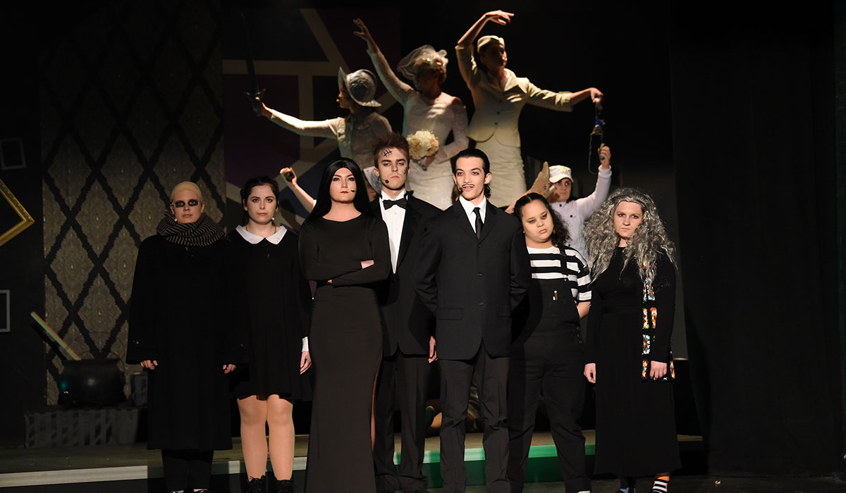students in the addams family play