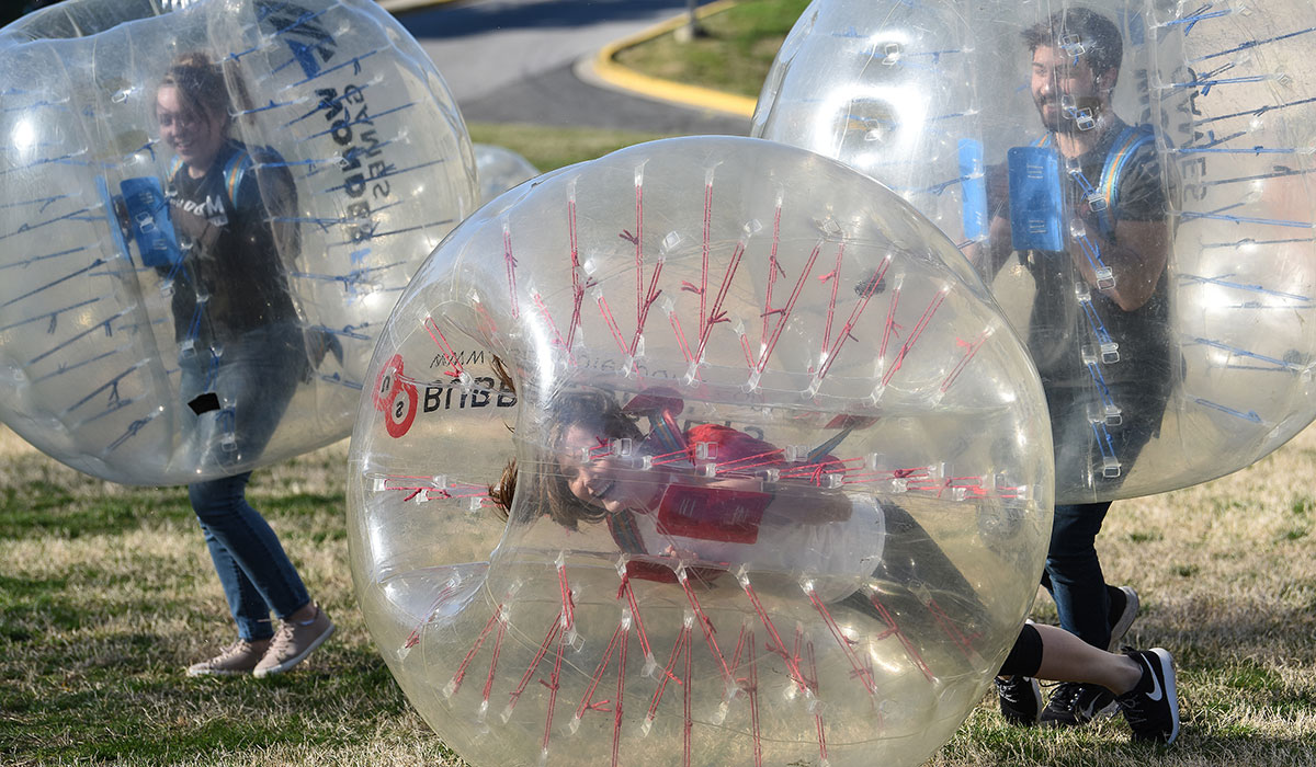 students playing bubble soccer