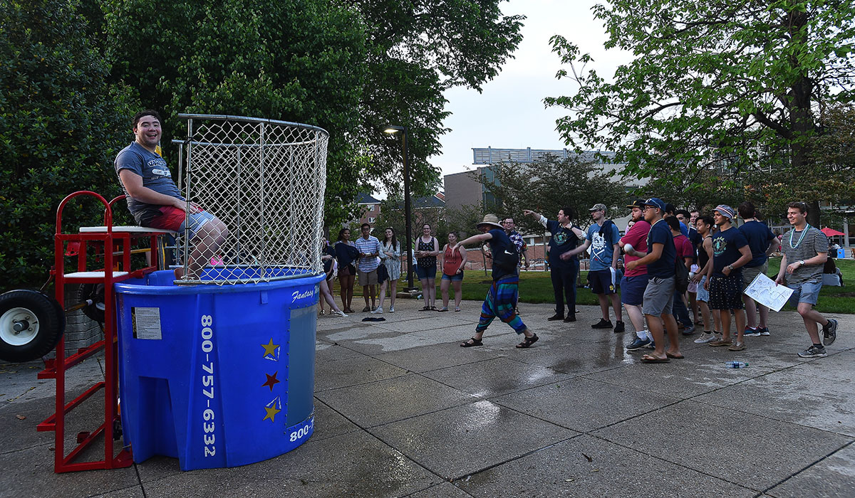 student in a dunk tank