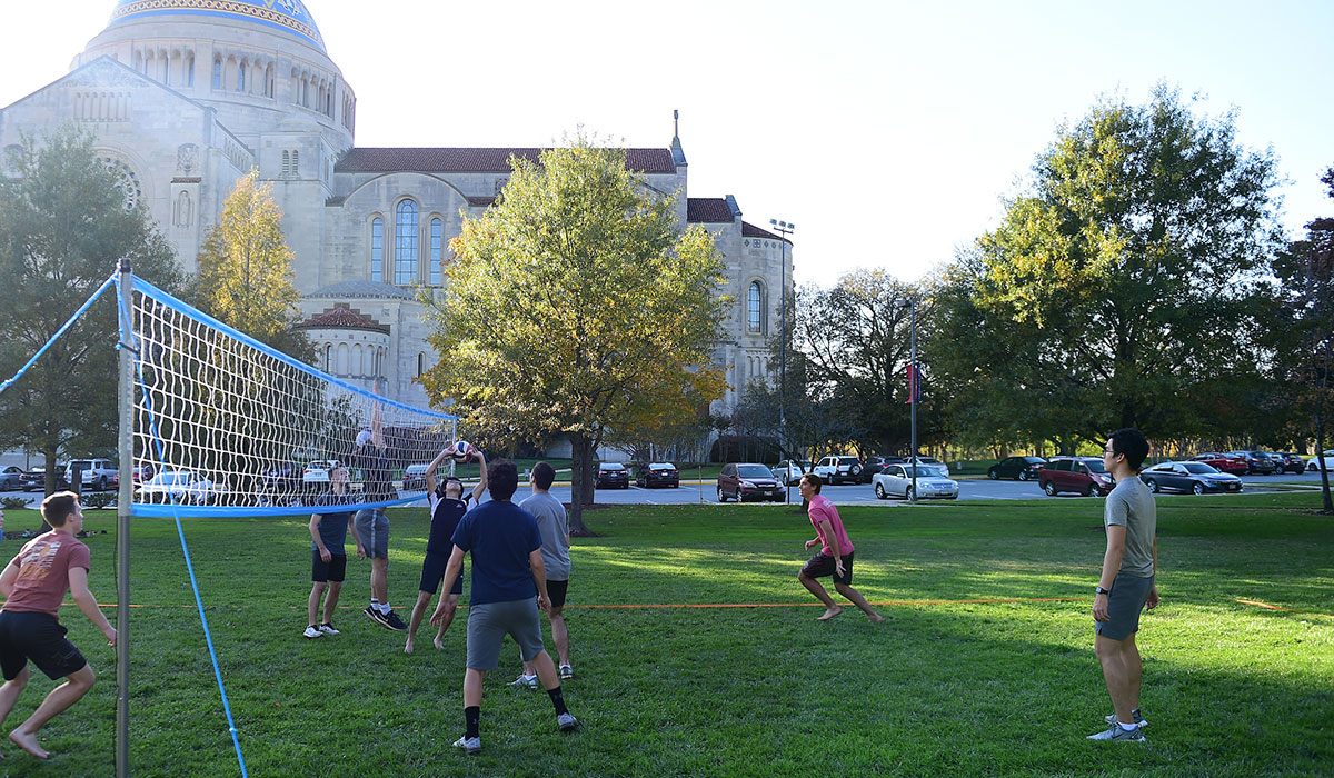 Students playing volleyball on University Mall