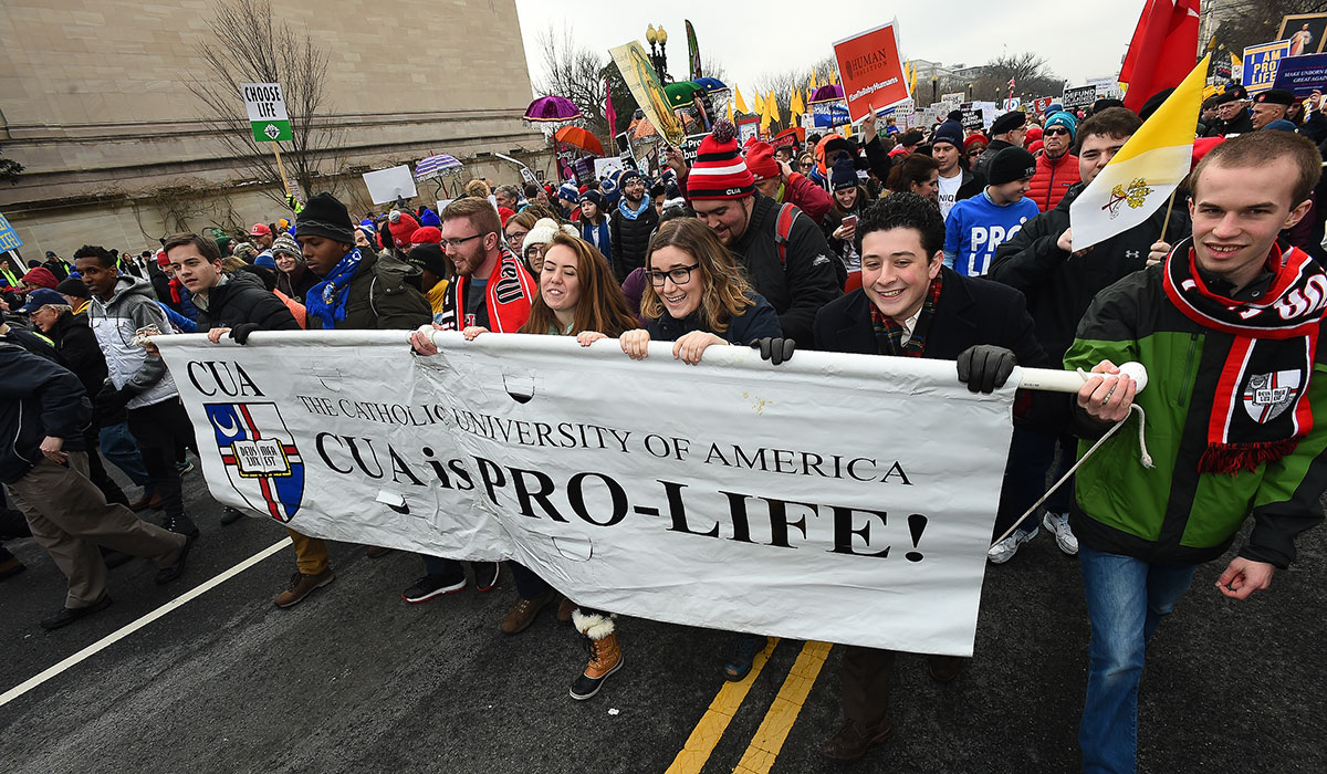 Students carry banner in March for Life