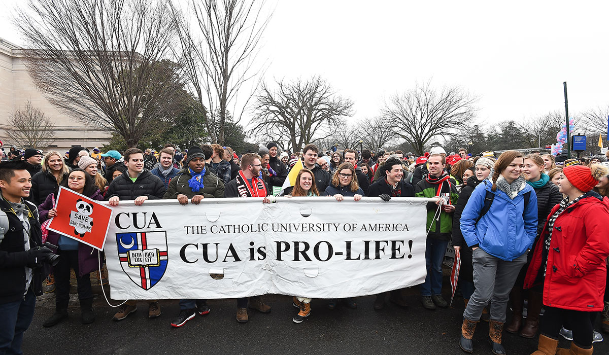 Students carrying Catholic University pro-life banner