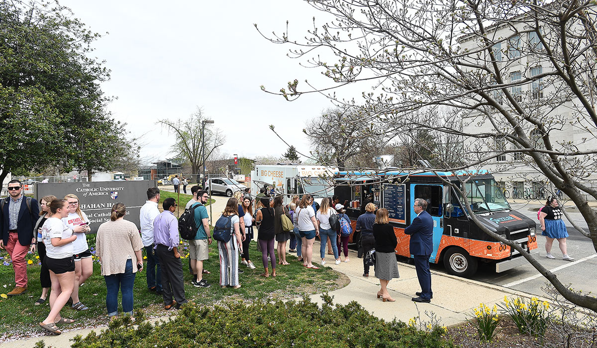 People lined up at food trucks