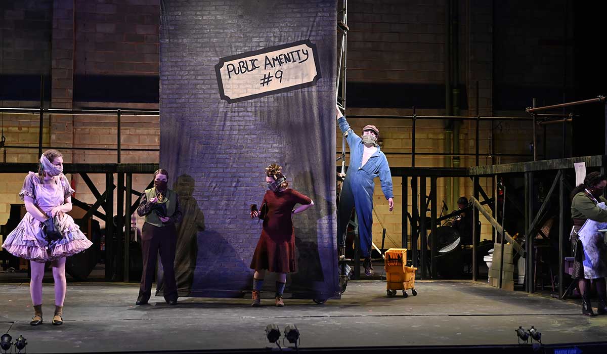 student performing in urinetown
