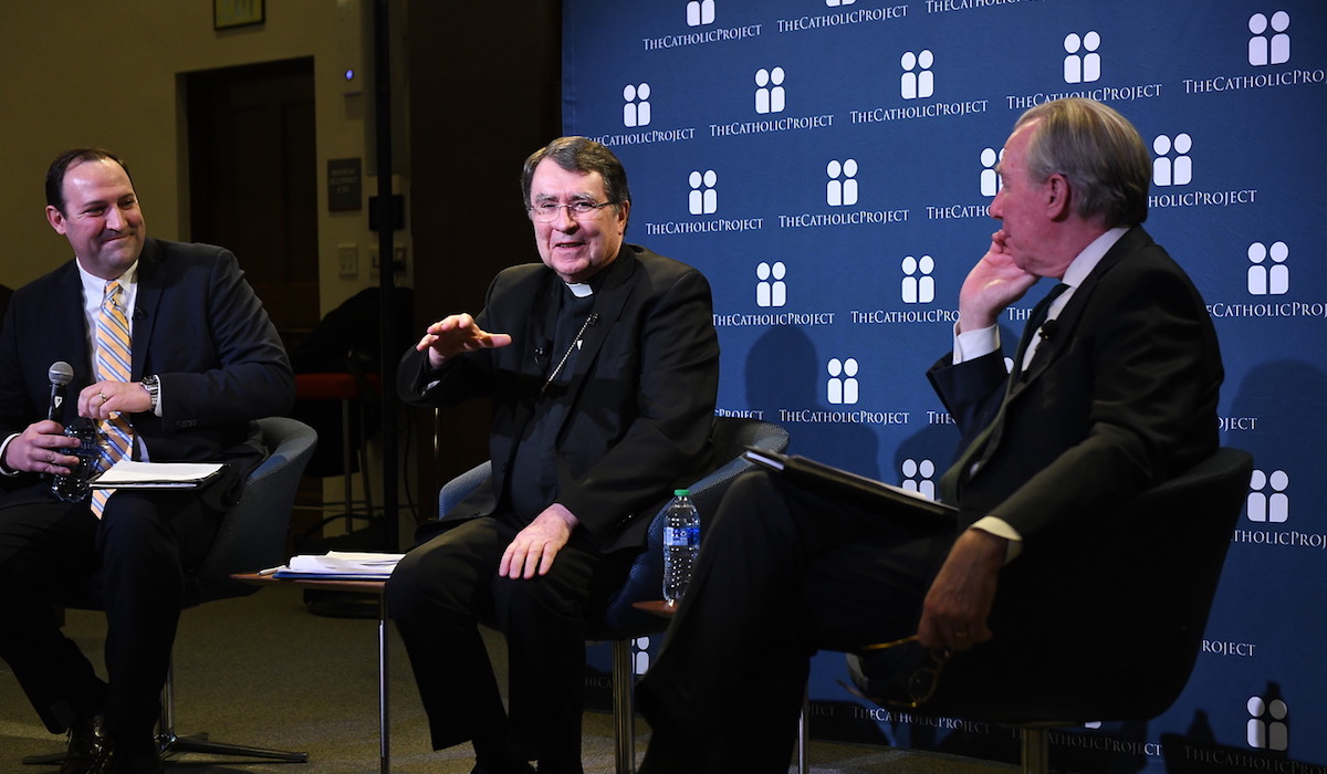 Stephen White, executive director of The Catholic Project; Papal Nuncio to the United States Archbishop Christophe Pierre, and President John Garvey talk together during Catholic University's Synod launch event. 