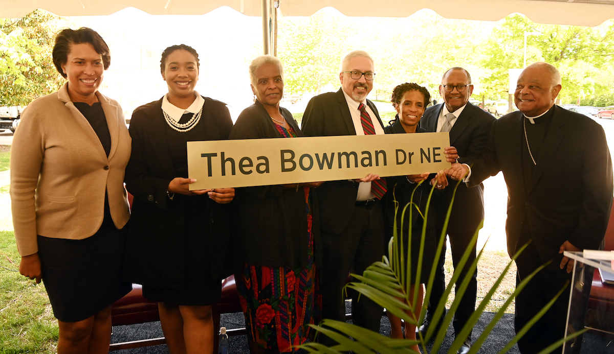 D.C. Mayor Muriel Bowser; alumni Kelly Woodson ‘22 and Elvira Wise Smith ‘73; Provost Aaron Dominguez; Professor Regina Jefferson, former chair of the Thea Bowman Committee; Professor Mel Williams, former special assistant to the President; and Cardinal Wilton Gregory, University chancellor and archbishop of Washington, hold the sign for Thea Bowman Drive at the street naming ceremony on April 29. 