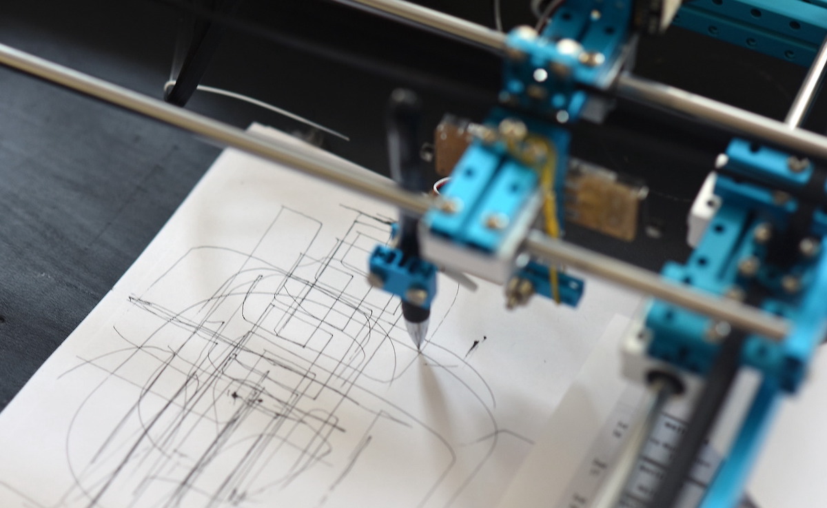 A machine makes drawings in an engineering lab