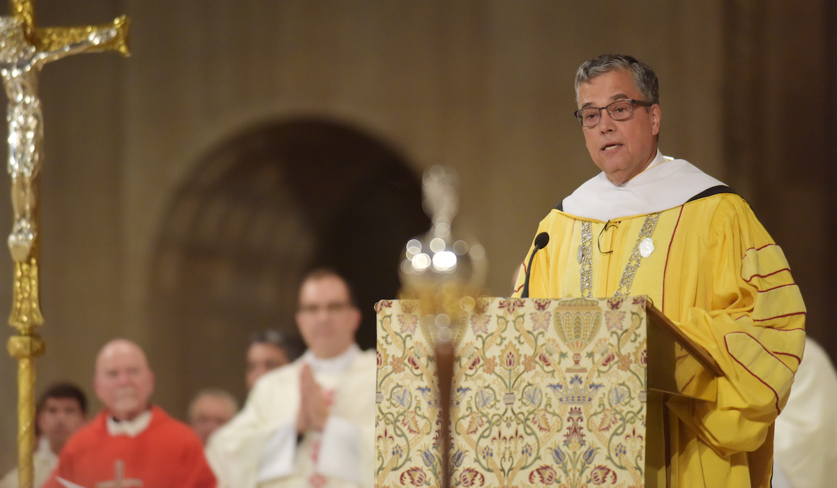 President Kilpatrick speaking in academic attire at the Mass of Holy Spirit in Sept. 2022