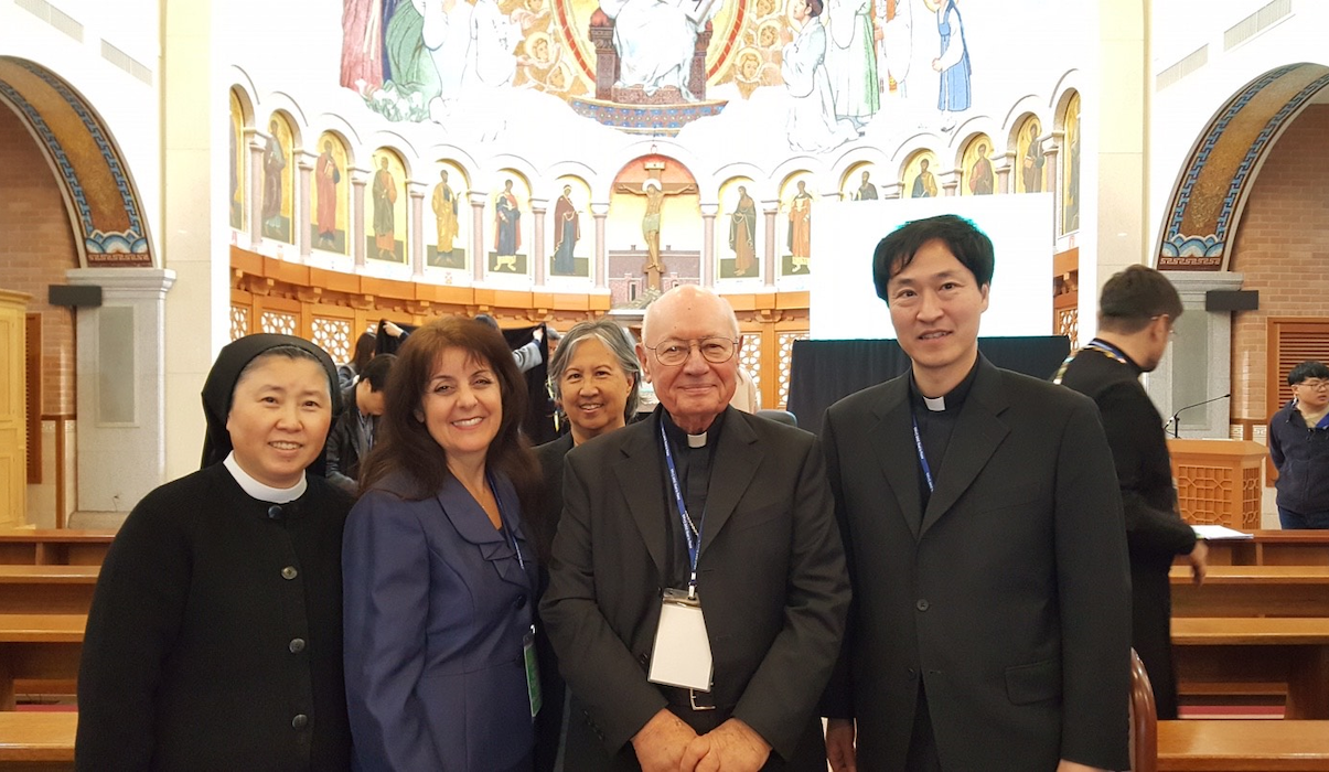 Maryann Love with South Korean colleagues inside of a Church